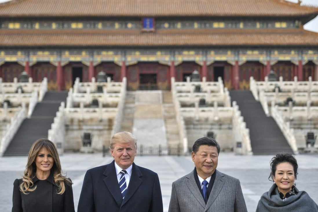 Melania Trump, US President Donald Trump, Chinese President Xi Jinping and his wife Peng Liyuan tour the Forbidden City in Beijing on Wednesday. Photo: AFP