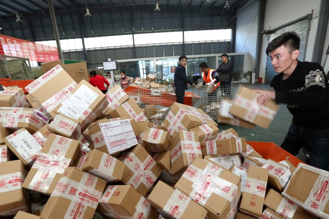Workers prepare boxes at a sorting centre in Lianyungang in Jiangsu province during the Singles’ Day online shopping festival. Photo: AFP