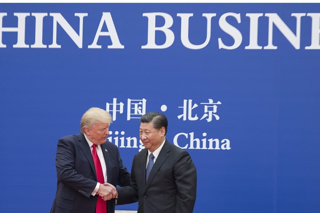 US President Donald Trump and China's President Xi Jinping at a business leaders event in Beijing. Photo: AFP