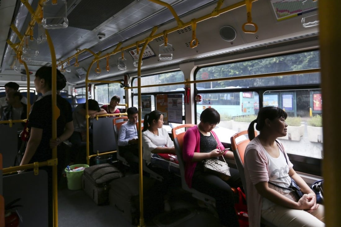 Passengers aboard an electric bus in Shenzhen. Picture: Xiaomei Chen