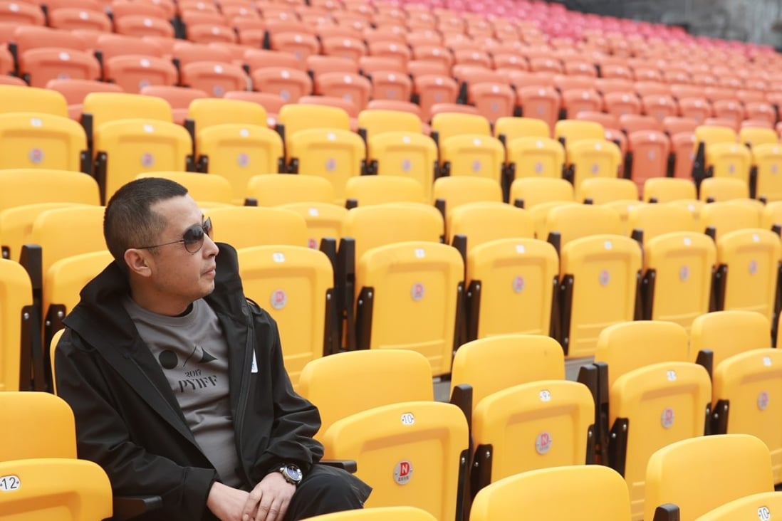 Jia Zhangke sits in the open-air cinema at Pingyao Cinema Palace, venue for the newly launched Pingyao International Film Festival. Photo: Clarence Tsui