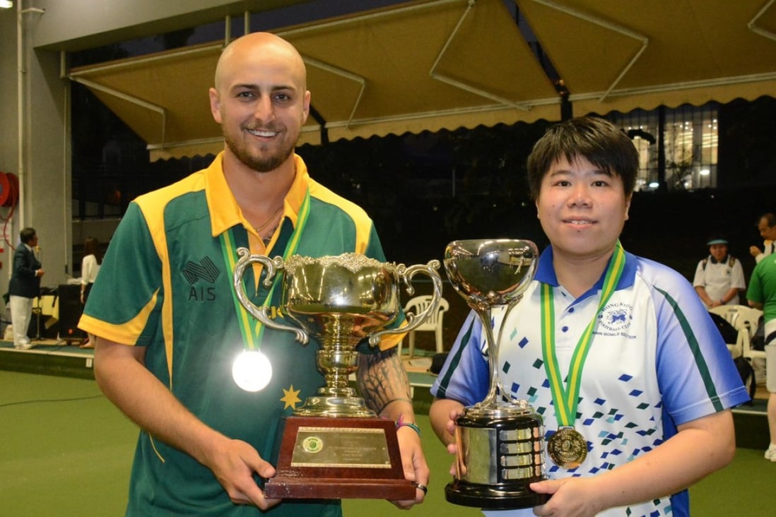 Jesse Noronha and Vivian Yip show off their trophies after winning their singles final on Sunday. Photo: Handout