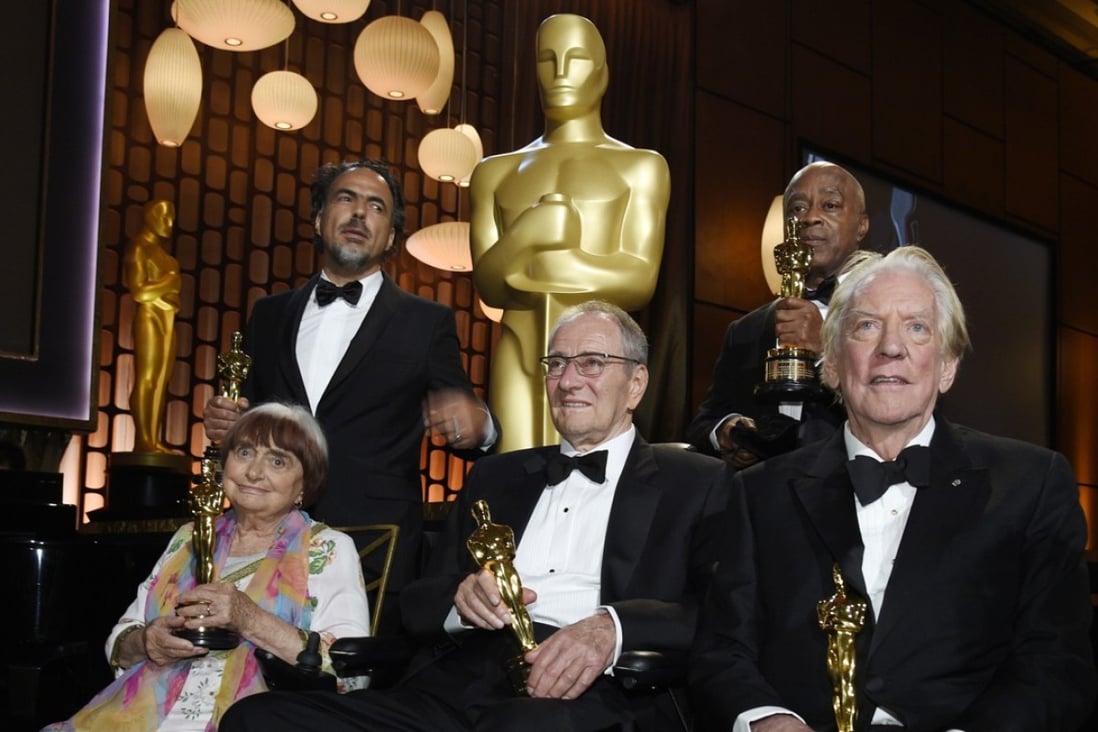 Governors Awards honorees (from left) Agnes Varda, Alejandro Gonzales Inarritu, Owen Roizman, Charles Burnett and Donald Sutherland pose with their Oscars following Saturday’s ceremony in Los Angeles. Photo: Chris Pizzello/Invision/AP