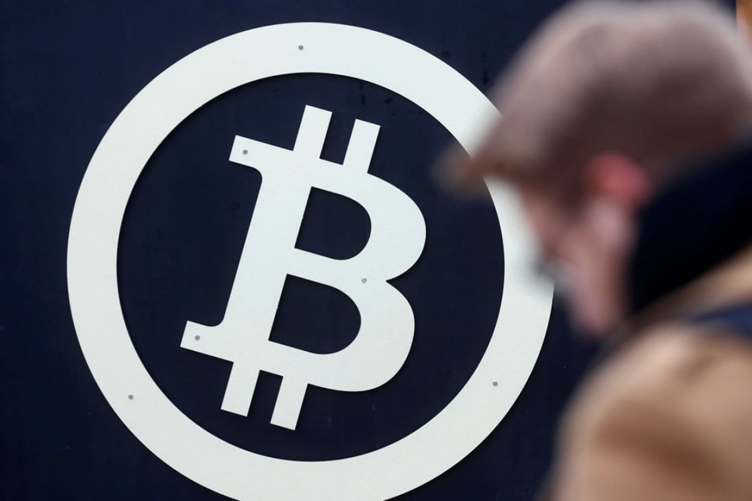 A bitcoin sign is seen during Riga Comm 2017, a business technology and innovation fair in Riga, Latvia. Photo: Reuters