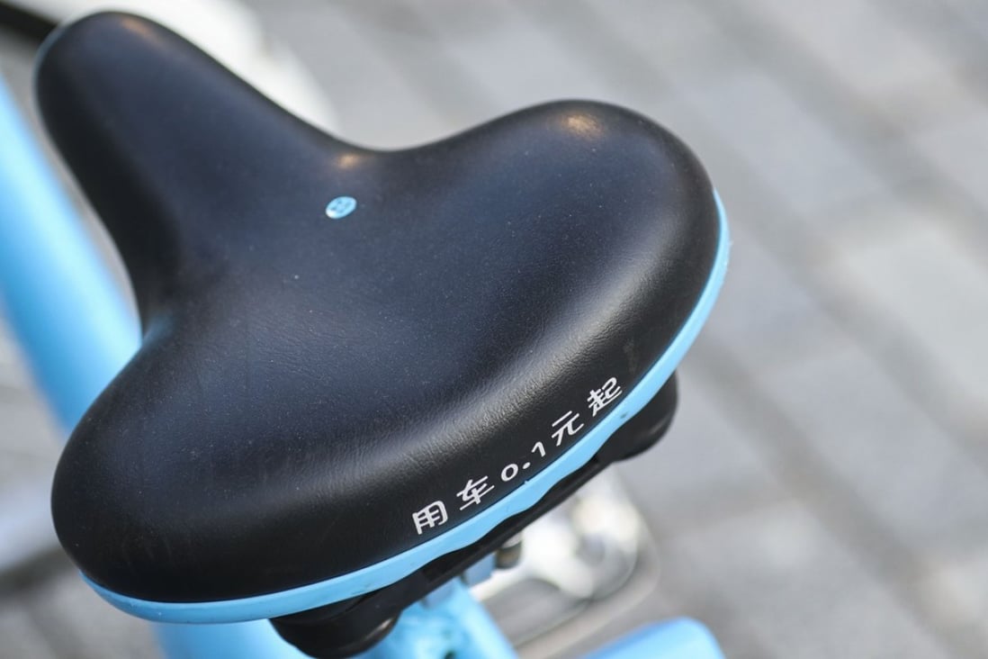 A price of 0.1 yuan is printed on the seat of a Bluegogo bike-sharing bicycle in the Futian district of Shenzhen. Photo: Roy Issa