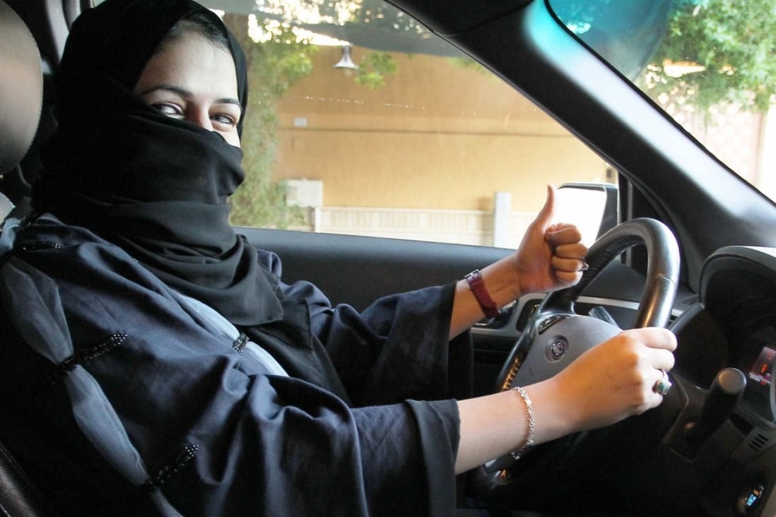 A woman behind the wheel in Riyadh – Saudi Arabia’s ban on female drivers will be lifted next year. Photo: EPA