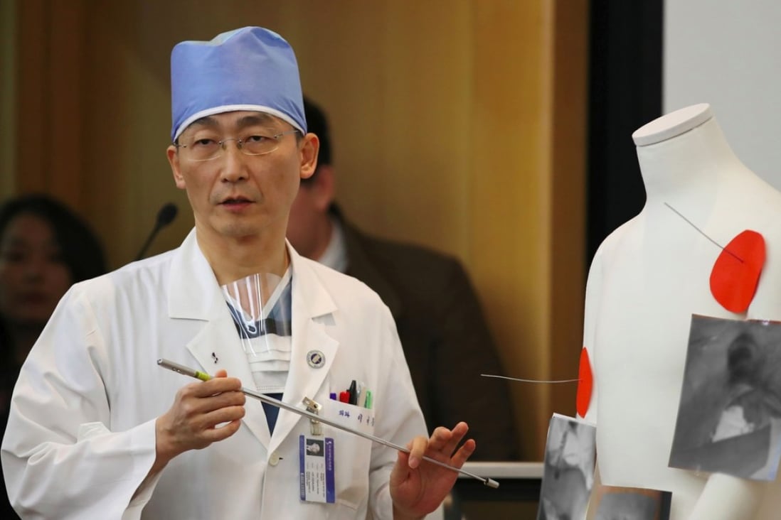 South Korean doctor Lee Cook-jong, who carried out surgery on gunshot wounds sustained by a North Korean soldier, speaks about the condition of the soldier during a briefing at Ajou University Hospital in Suwon, south of Seoul, on November 15. Photo: Agence France-Presse