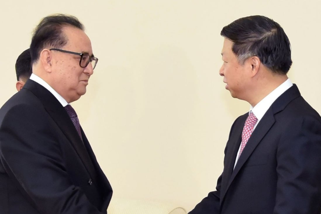 Ri Su-yong (left), vice-chairman of North Korea's ruling party, greets Song Tao, head of China's Communist Party's International Liaison Department, in Pyongyang on Saturday. Photo: Kyodo