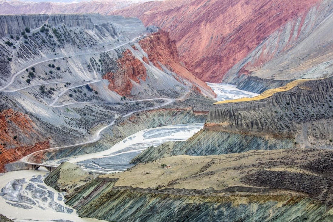 A river carves through a colourful canyon in the Tianshan Mountains in Xinjiang, China. In the absence of direct sunlight, the colours and texture of the canyon are flattened into a two-dimensional oil painting. Photo: Tugo Cheng