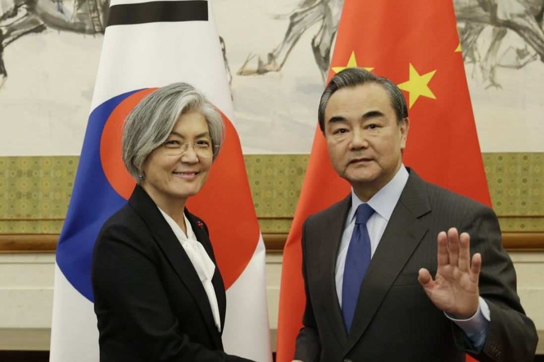 South Korean Foreign Minister Kang Kyung-wha meets Chinese Foreign Minister Wang Yi at the Diaoyutai State Guesthouse in Beijing on Wednesday. Photo: EPA