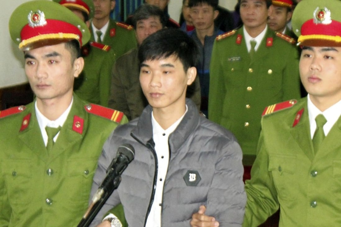 Nguyen Van Hoa (centre) was sentenced to seven years in prison. Photo: AP