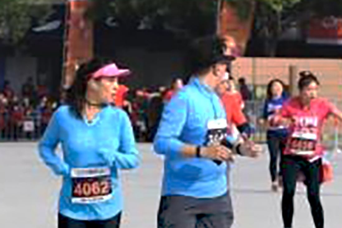 Shanghai halfmarathon runner collapses and dies within sight of the