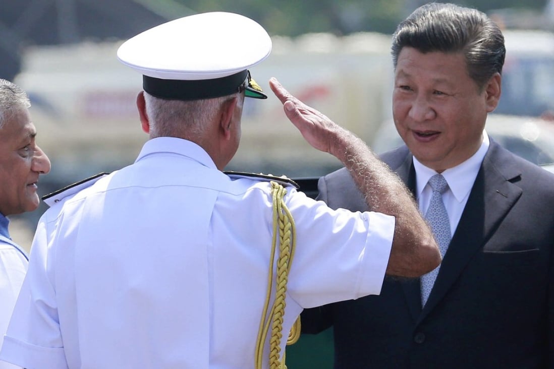 An Indian Navy officer salutes Chinese President Xi Jinping on his arrival in Goa, India, in October 2016 for the BRICS summit. Photo: AP