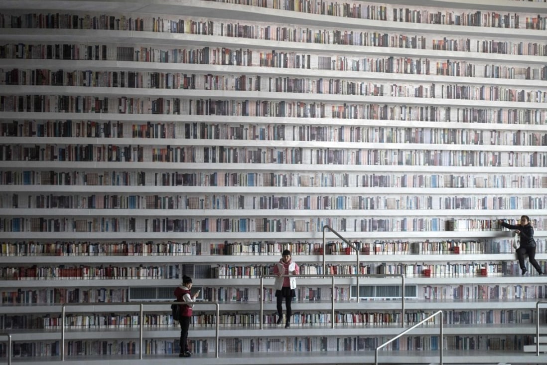 At the Tianjin Binhai Library, rows upon rows of book spines are mostly images printed on the aluminium plates that make up the backs of shelves. Photo: AFP
