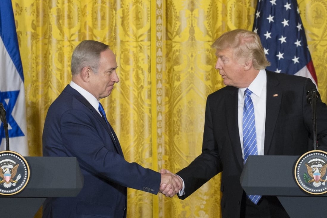 US President Donald Trump shakes hands with Israeli Prime Minister Benjamin Netanyahu during his visit to the white house on 15 February 2017. Trump has declared Jerusalem the capital of Israel and ordered the relocation of the US embassy from Tel Aviv. Photo: EPA