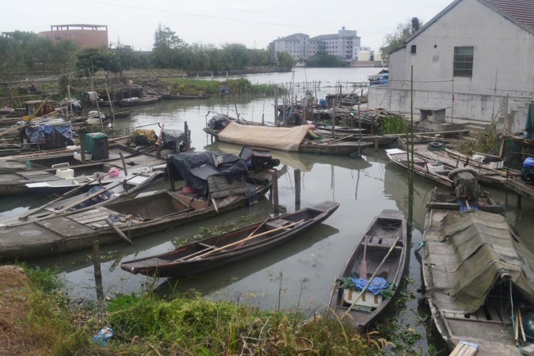 Fishing boats line the riverbank in Yucheng, Zhejiang province. Photo: Sidney Leng
