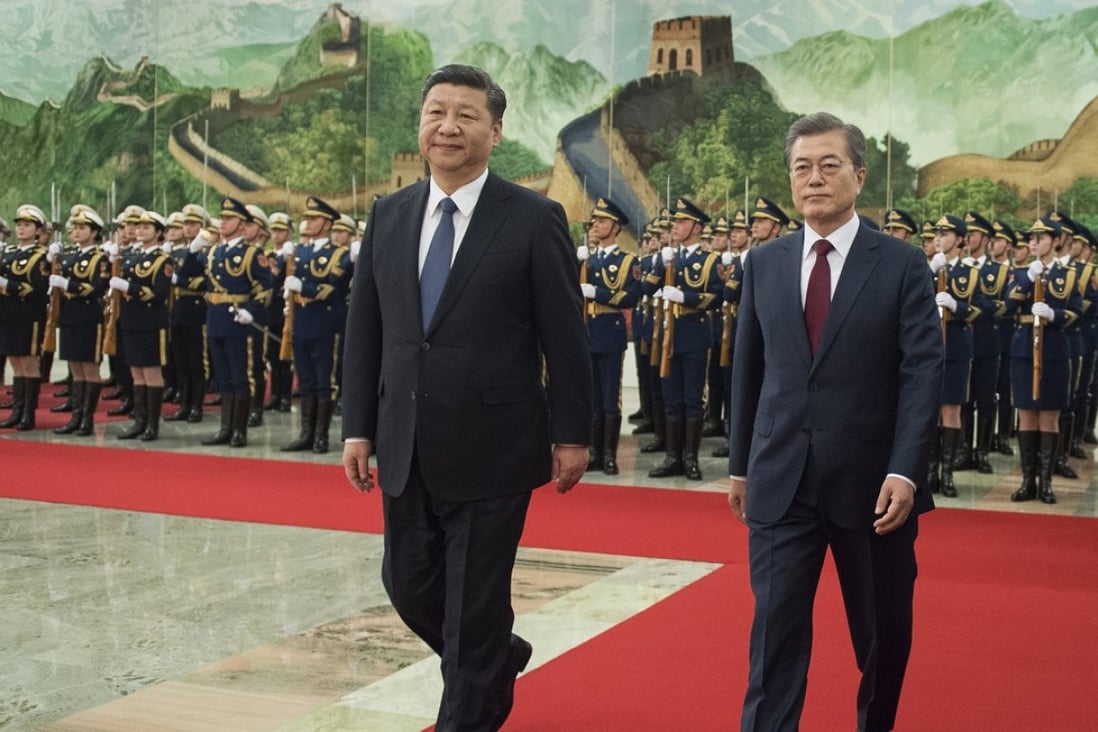 Xi Jinping welcomes his South Korean counterpart Moon Jae-In to the Great Hall of the People on Thursday. Photo: EPA-EFE