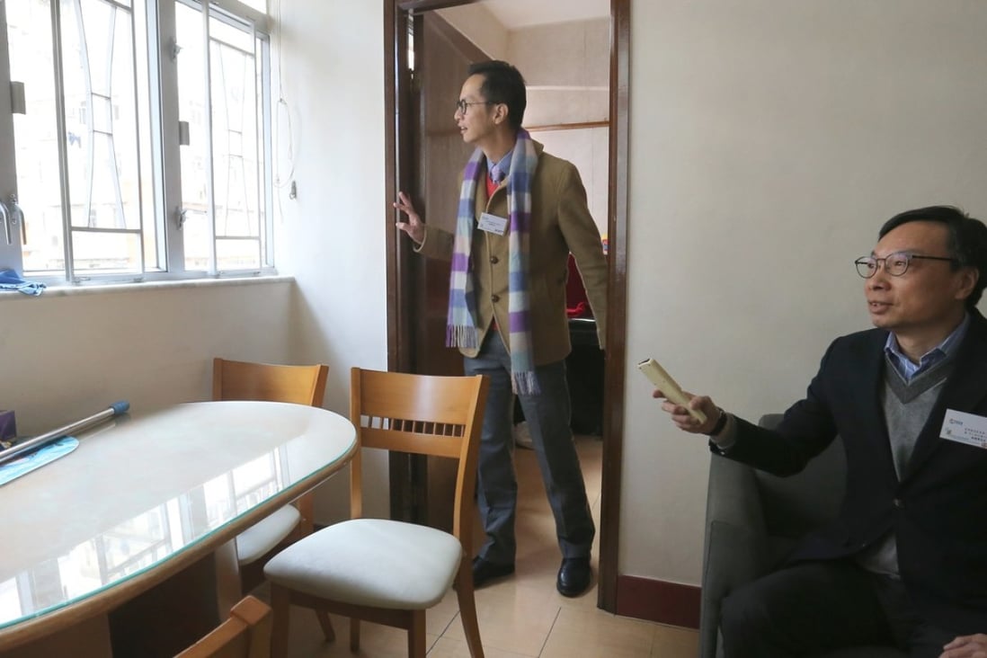 Anthony Wong, business director of the Hong Kong Council of Social Service (right) and Eddie Lam, first vice-president of the Hong Kong Construction Association, inside one of the flats in To Kwa Wan. Photo: Dickson Lee