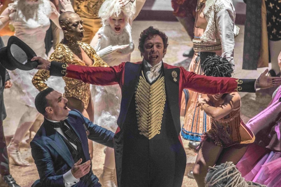 Hugh Jackman (centre) as P.T. Barnum in The Greatest Showman (category: IIA). The film, which co-stars Michelle Williams, Zac Efron, and Rebecca Ferguson, is directed by Michael Gracey.