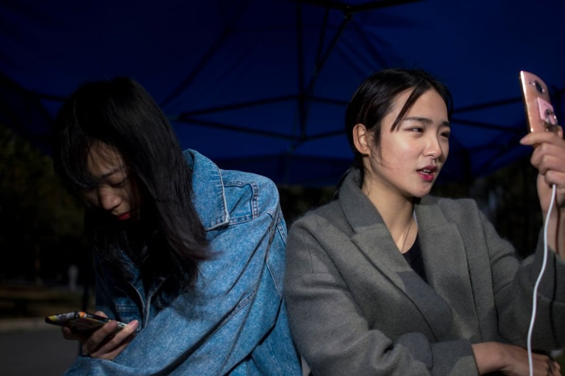 Jiang Mengna (right) live broadcasts during a break at the Yiwu Industrial & Commercial College in Yiwu, Zhejiang Province. Monthly active viewers of live streaming with an entertainment element have been in decline since December 2016. Photo: AFP