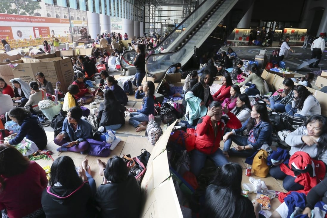 Domestic helpers during a weekend gathering on a street in Central. Photo: Dickson Lee