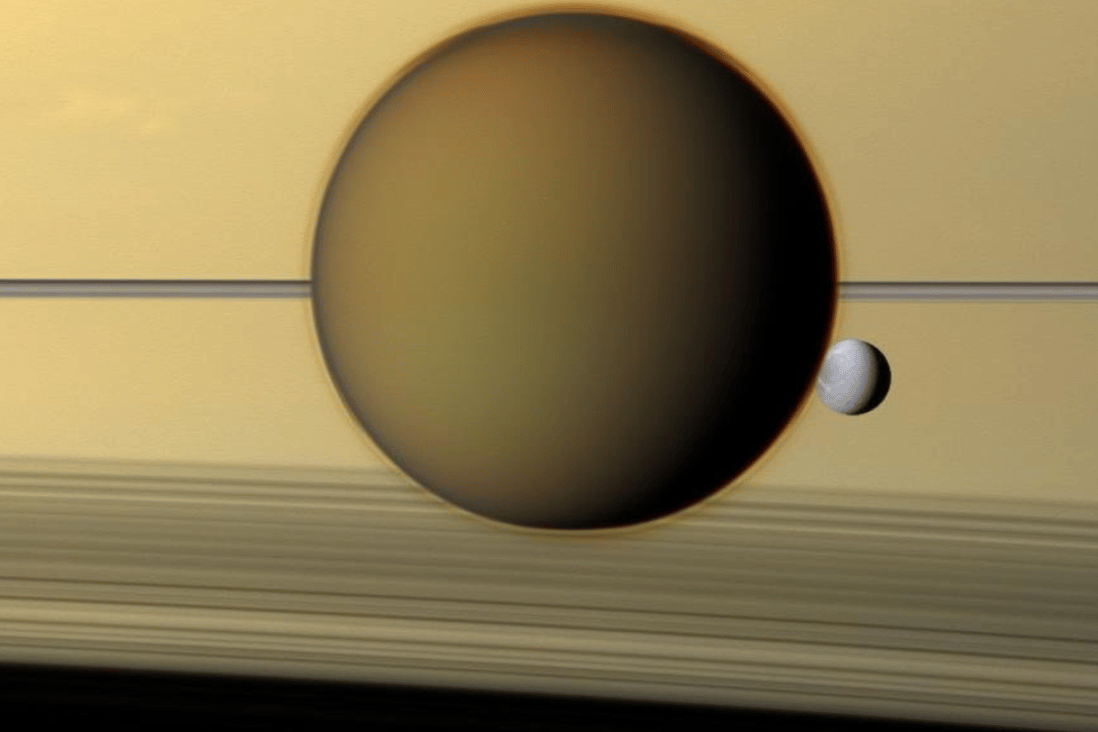 Saturn's fourth-largest moon, Dione, passing behind the ringed planet's largest moon, Titan, in a view from NASA's Cassini spacecraft. Photo: NASA/JPL-Caltech/Space Science Institute