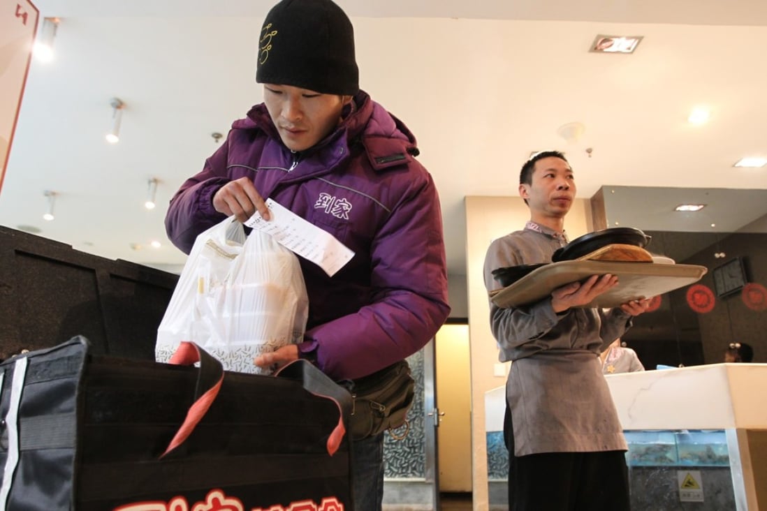 Restaurant owners in China have tapped on mobile apps to expand their customer reach and business scope including food delivery service. Photo: Simon Song