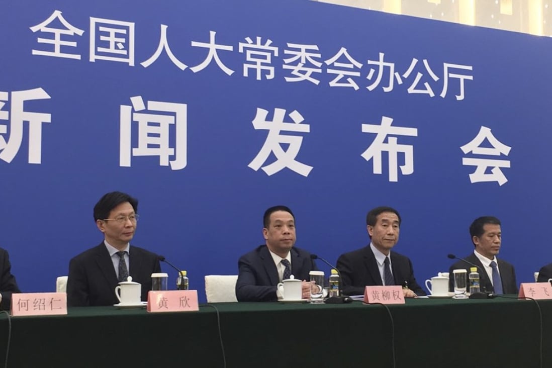 Li Fei (fourth from left), held a press conference on Wednesday after the NPC Standing Committee’s decision to explain the legal basis for the co-location arrangement. Photo: Phila Siu