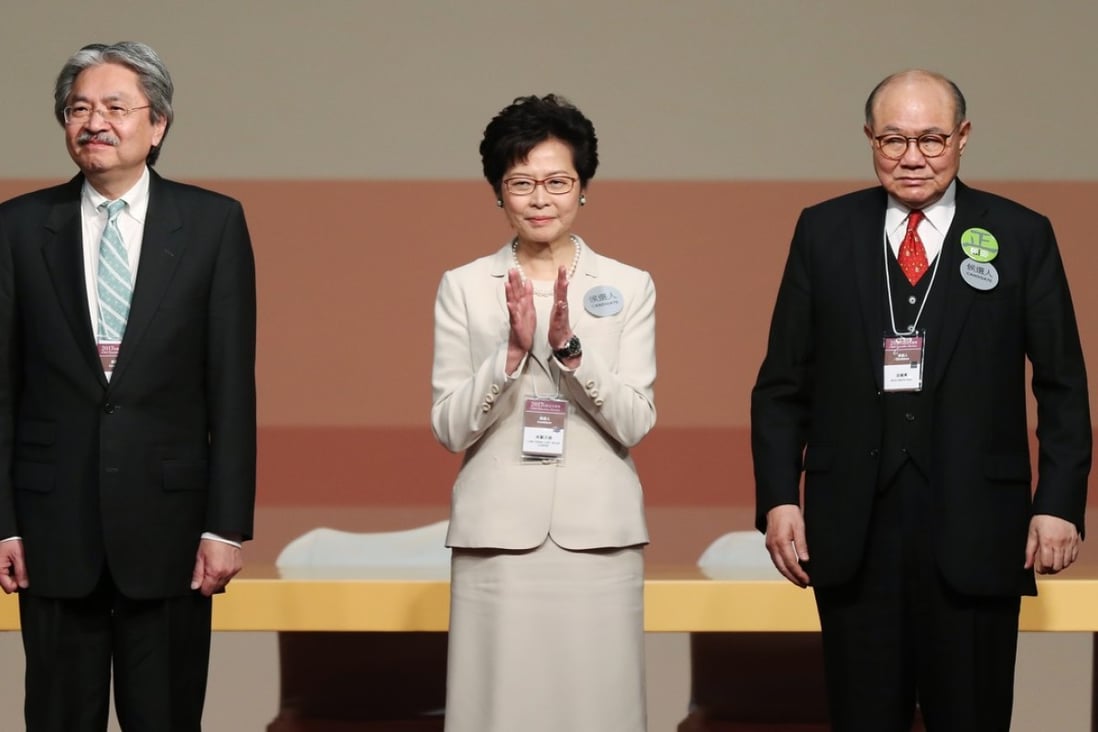 Carrie Lam, flanked by her chief executive election rivals John Tsang (left) and Woo Kwok-hing, vowed to unite a city divided by her predecessor. Photo: Robert Ng