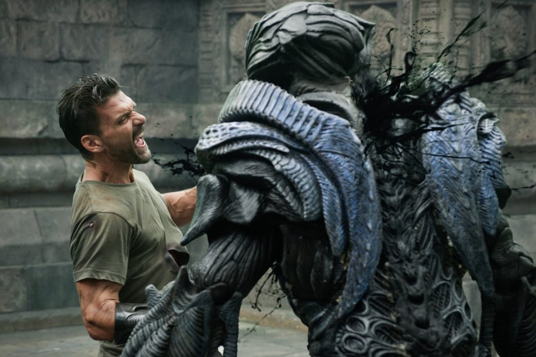 Frank Grillo fights an alien in a scene from Beyond Skyline (category IIB; English, Bahasa Indonesia). The film, directed by Liam O’Donnell, co-stars Iko Uwais and Bojana Novakovic.