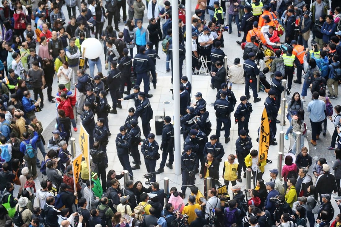 Protesters end their march and gather at Civic Square outside government headquarters in Admiralty. Photo: Felix Wong