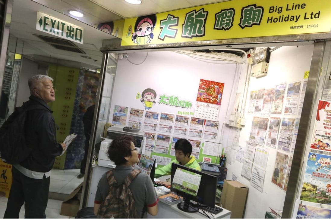 Customers visit Big Line Holiday’s shop in Wan Chai. Photo: Sam Tsang
