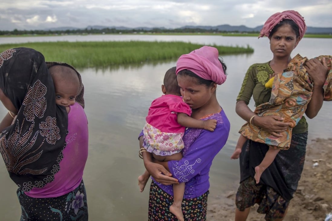 Rohingya Muslim women holding their children. Photo: AP