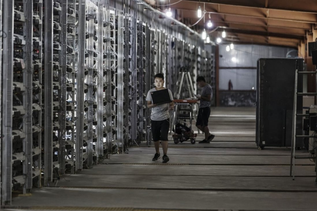 Technicians inspect bitcoin mining machines at a mining facility operated by Bitmain Technologies in Ordos, Inner Mongolia on August 11, 2017. Bitcoin is showing no signs of slowing down, the price of the largest cryptocurrency by market value is soaring as it gains greater mainstream attention despite warnings of a bubble in what not everyone agrees is an asset. Our editors select the best archive images on Bitcoin. Photo: Bloomberg