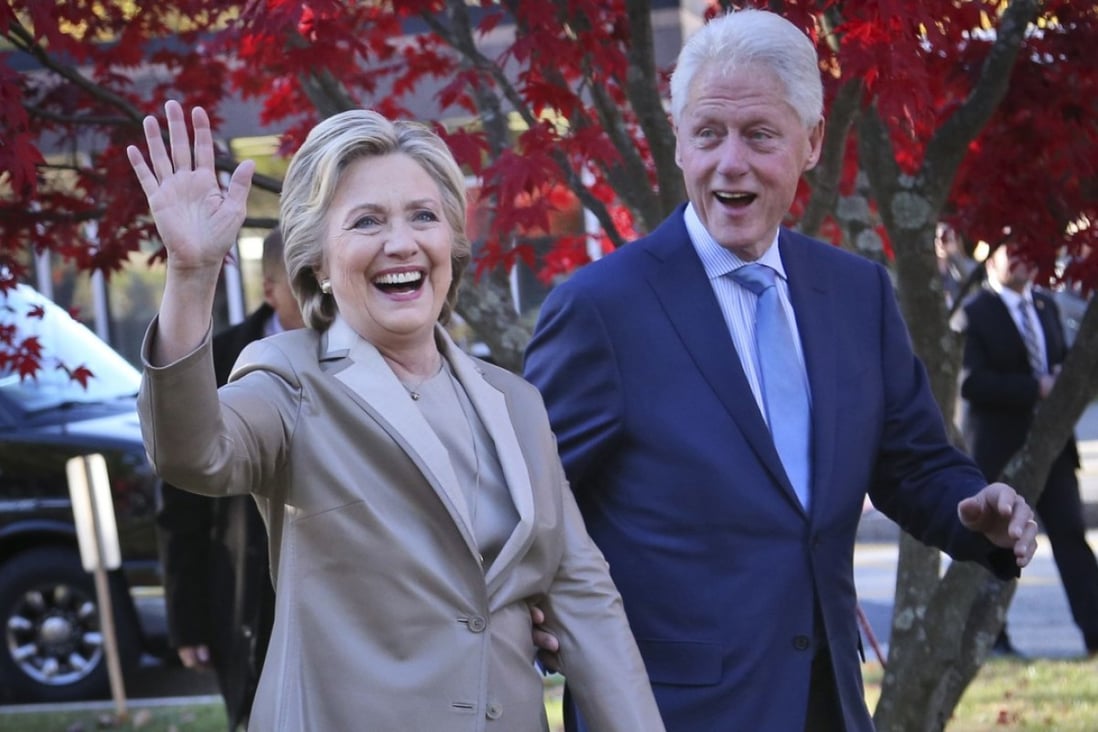 FILE - In this Nov. 8, 2016, file photo, then-Democratic presidential candidate Hillary Clinton, and her husband former President Bill Clinton, greet supporters after voting in Chappaqua, N.Y. The FBI is investigating allegations of corruption connected to the Clinton Foundation while Hillary Clinton was secretary of state. That’s according to a person familiar with the investigation who spoke on condition of anonymity to discuss it. (AP Photo/Seth Wenig, File)