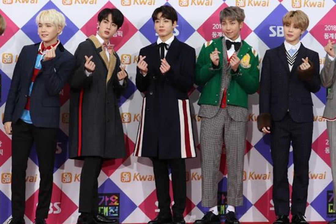 Members of K-pop boy band BTS pose during an SBS year-end programme at Gocheok Sky Dome in Seoul. The band has broken into the US Top 40 with the track ‘MIC Drop’. Photo: Yonhap