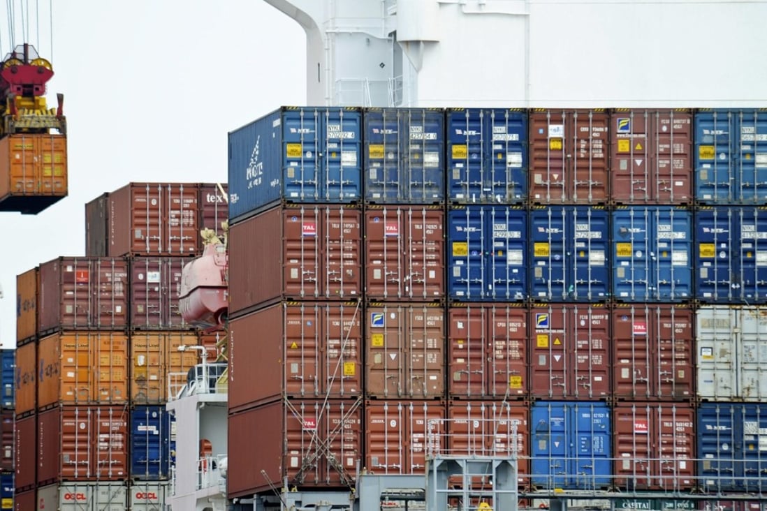 A container is loaded onto a cargo ship at the Tianjin port in China. The US government owes China US$1.2 trillion. Photo: AP