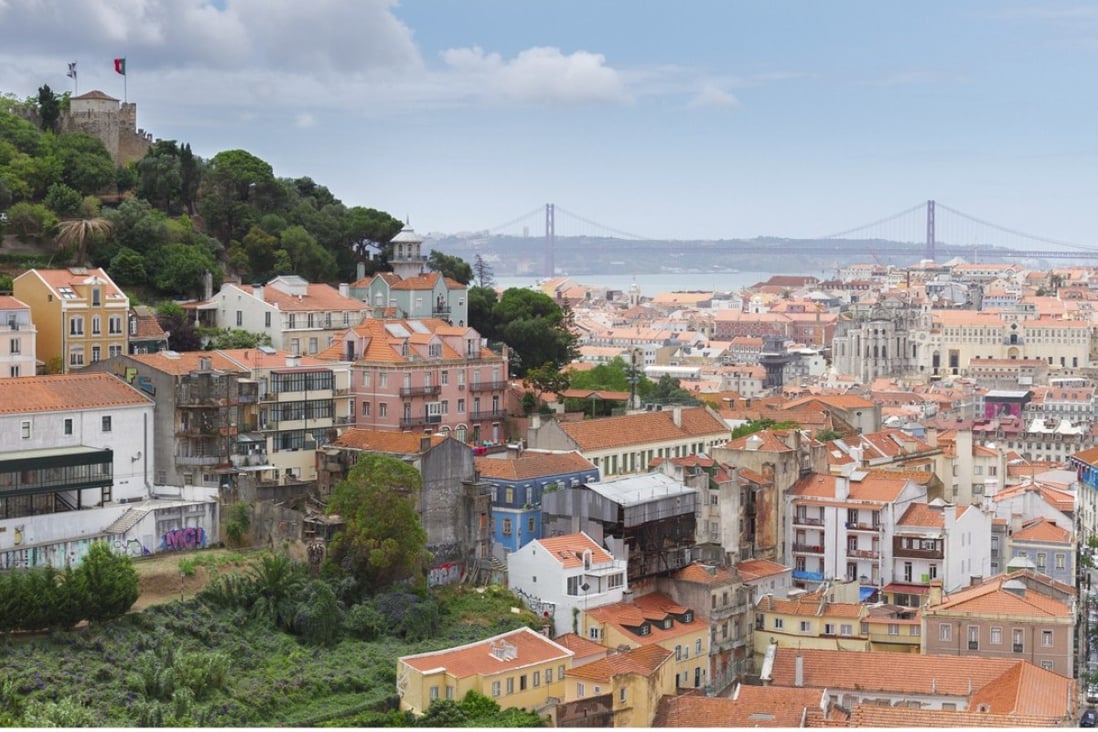 A view over the Portuguese capital of Lisbon. The country’s unemployment rate is falling and its offer of residency for investment has attracted money from overseas, pulling away from the depths of its economic crisis and presenting opportunities for investors. Photo: Alamy