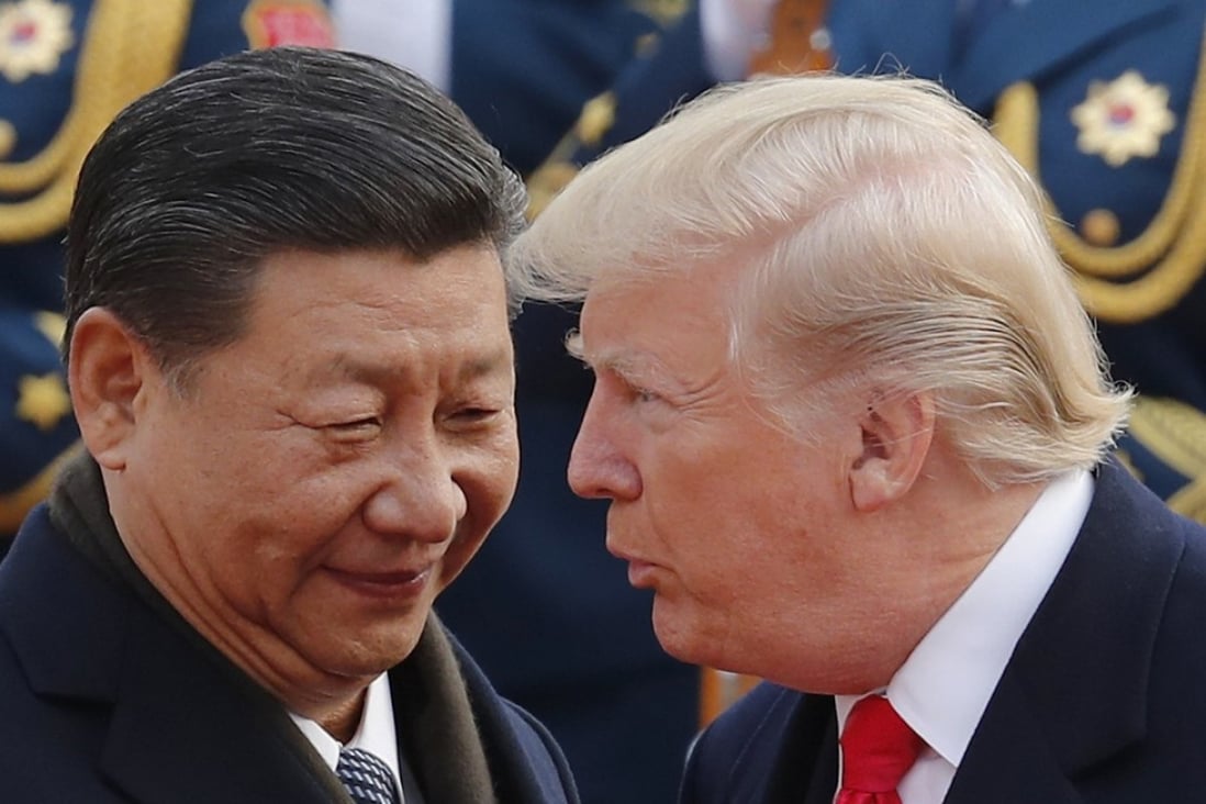 US President Donald Trump (right) chats with Chinese President Xi Jinping during a welcome ceremony at the Great Hall of the People in Beijing. Photo: AP
