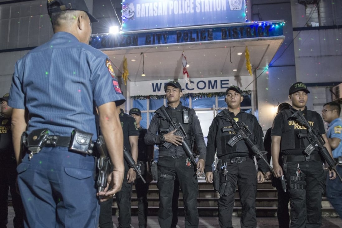 Armed police officers at Batasan Police Station 6, in Manila, prepare to mount an anti-drug roadblock on December 14, 2017. Pictures: Zigor Aldama