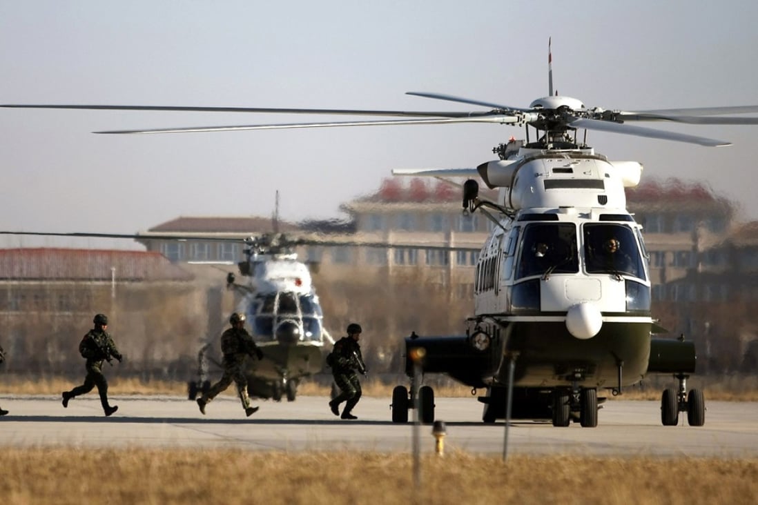 Chinese and Russian special operations soldiers run to board a helicopter during a joint exercise in December. Photo: China Military