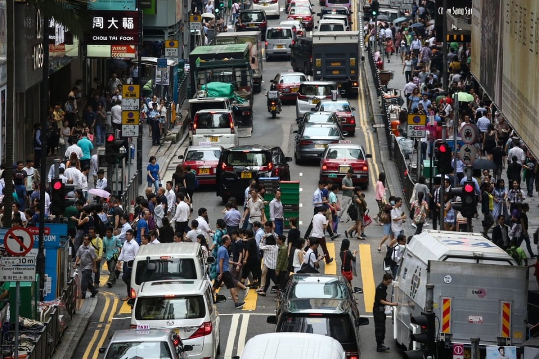 Traffic inches forward as parked vehicles clog the roads in Central. Photo: Jonathan Wong