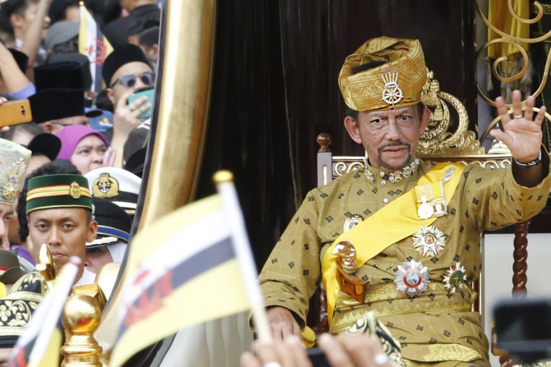 Brunei's Sultan Hassanal Bolkiah waves to well-wishers during a procession as part of the Golden Jubilee celebrations in Bandar Seri Begawan, Brunei in 2017. File photo: EPA