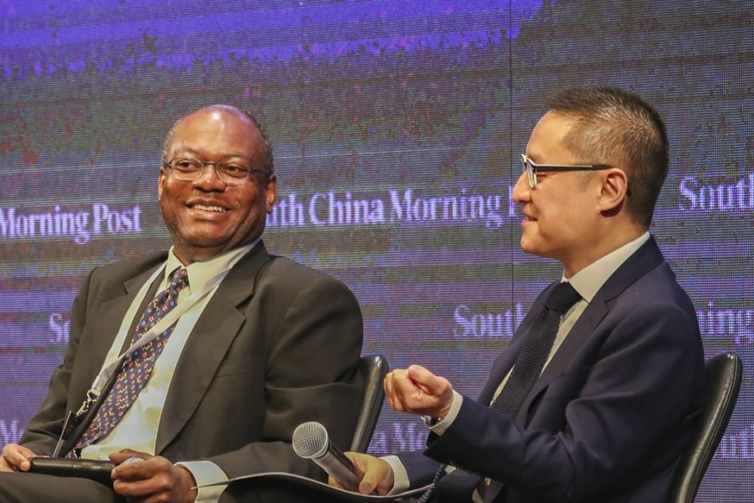Journalist Keith Richburg and venture capitalist Eric Li take the stage at the SCMP's China Conference in Hong Kong on Thursday. Photo: Nora Tam