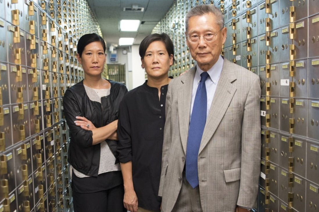 Vera Sung (left), Jill Sung and their father, Thomas Sung, in the safety deposit box area of Abacus Federal Savings Bank in New York's Chinatown. A documentary about their legal battle against the US government is in the running for an Oscar. Photo: Sean Lyness, courtesy Kartemquin Films.