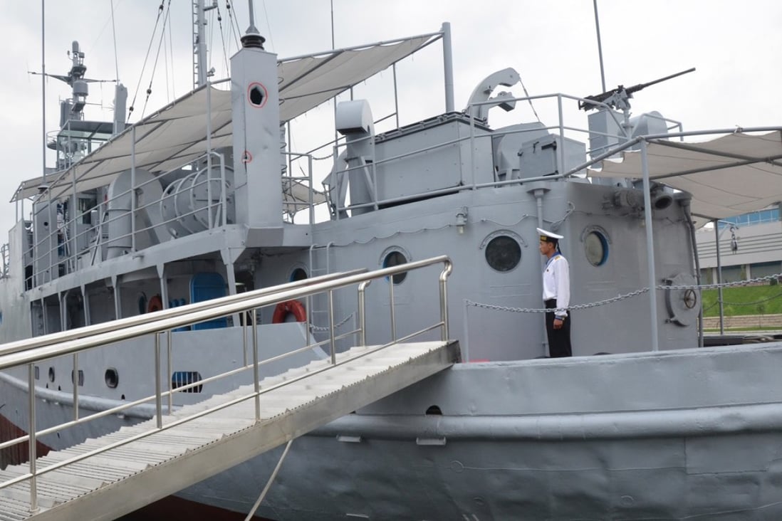 A North Korean seaman aboard the USS Pueblo, a US Navy ship captured by North Korea in 1968 and now moored in Pyongyang and serving as a museum and symbol of North Korean military might. Picture: AFP