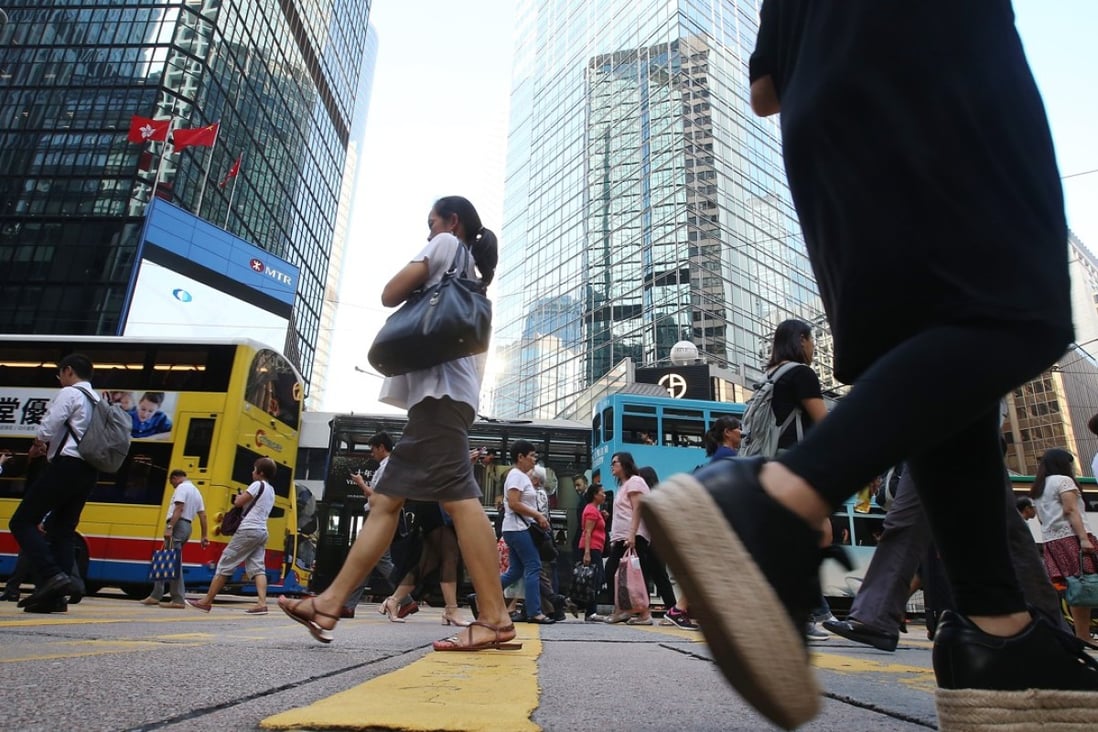 Pedestrians walking in Central on Hong Kong island. Photo: K. Y. Cheng