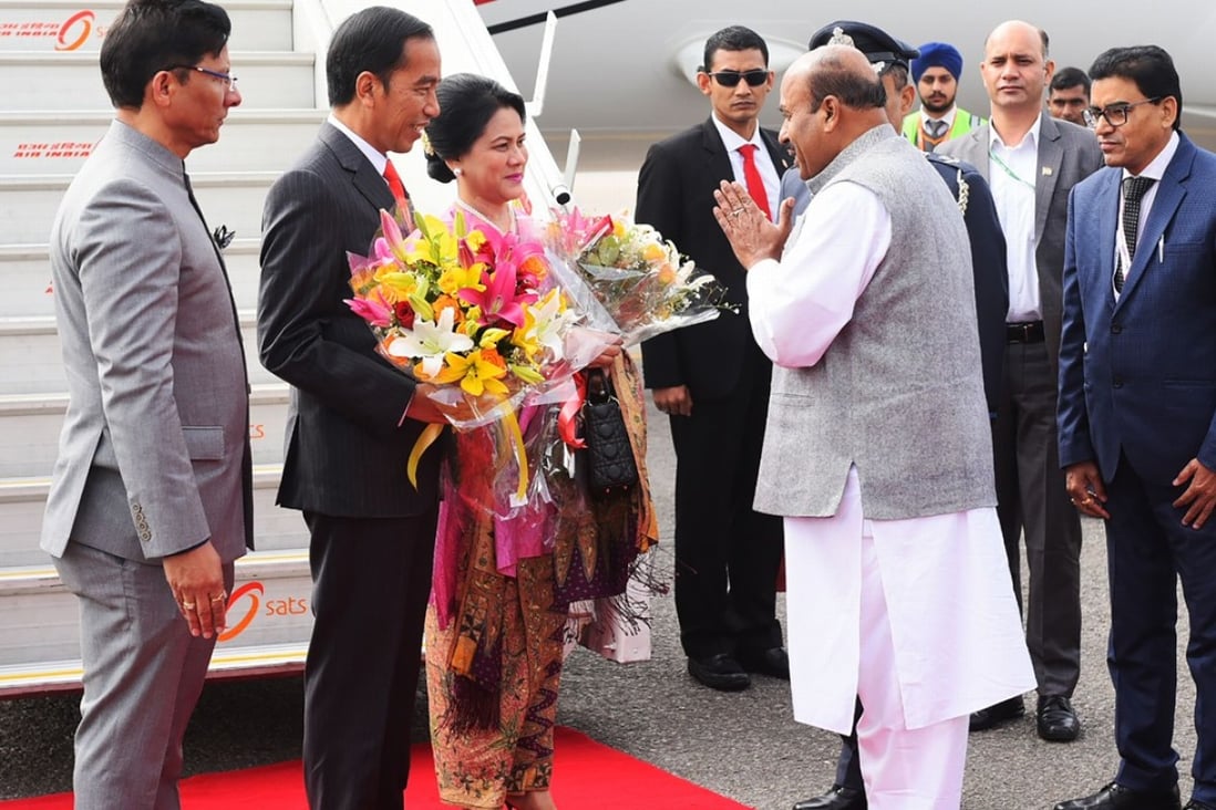 Indonesian President Joko Widodo, second from left, arrives with his wife Iriana to participate in the Asean-India Commemorative Summit in New Delhi. Photo: AFP