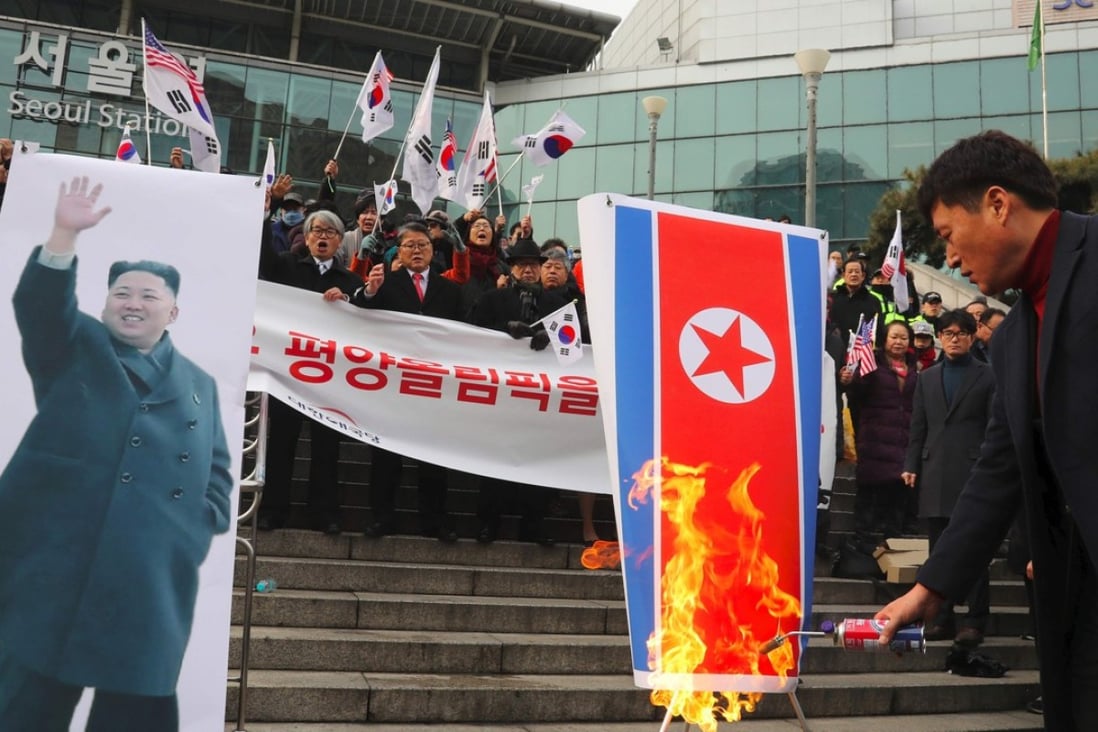 South Korean protesters burn a North Korean flag and a picture of Kim Jong-Un during an anti-North Korea rally outside Seoul station in Seoul on January 22. On Monday North Korea abruptly cancelled a joint cultural event with the South citing a ‘biased media’. File photo: Agence France-Presse/YONHAP