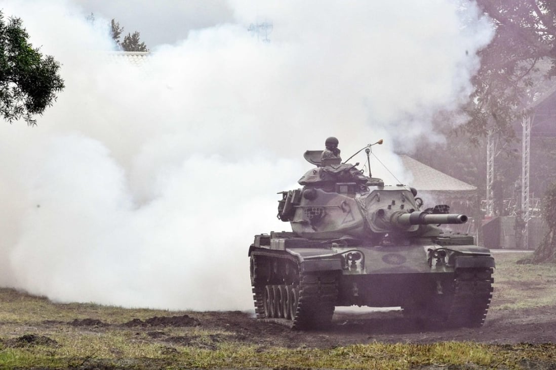 A Taiwanese tank crew takes part in an annual drill at a military base in the eastern city of Hualien on Tuesday. Photo: AFP